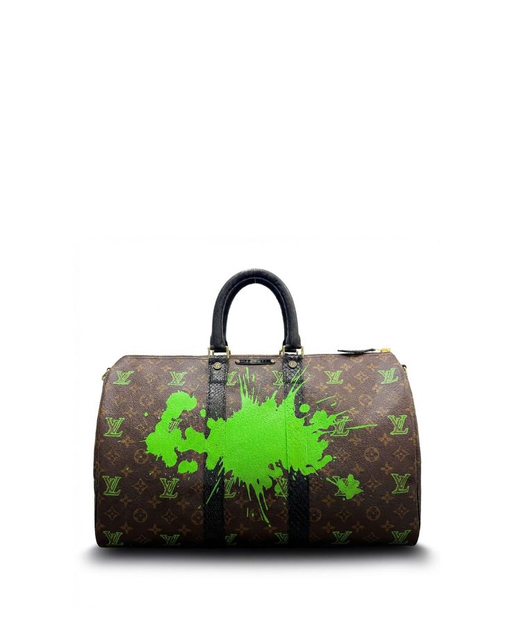 Philip Karto vintage Louis Vuitton handbag with green paint splashes on a white background