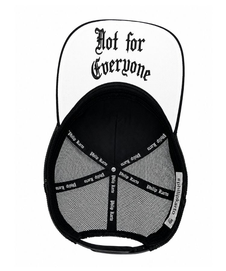 A black and white trucker-style cap shown from the back, featuring a white front panel with the gothic text 'Not for Everyone' in black, a black mesh back, and 'Philip Karto' printed repeatedly on the black side straps.