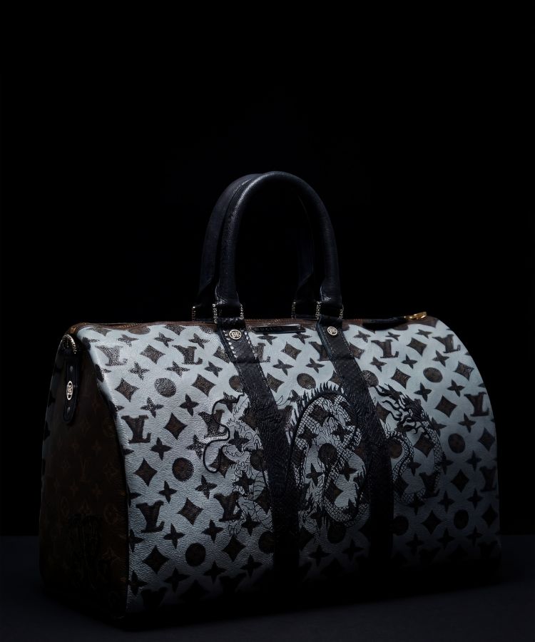 Patterned duffel bag on a black background