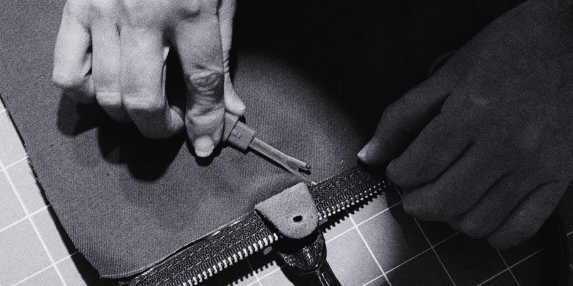 Image representing a dtailed action of desmantling a Louis Vuitton bag for the Philip Karto process in creating collectible Louis Vuitton vintage bags