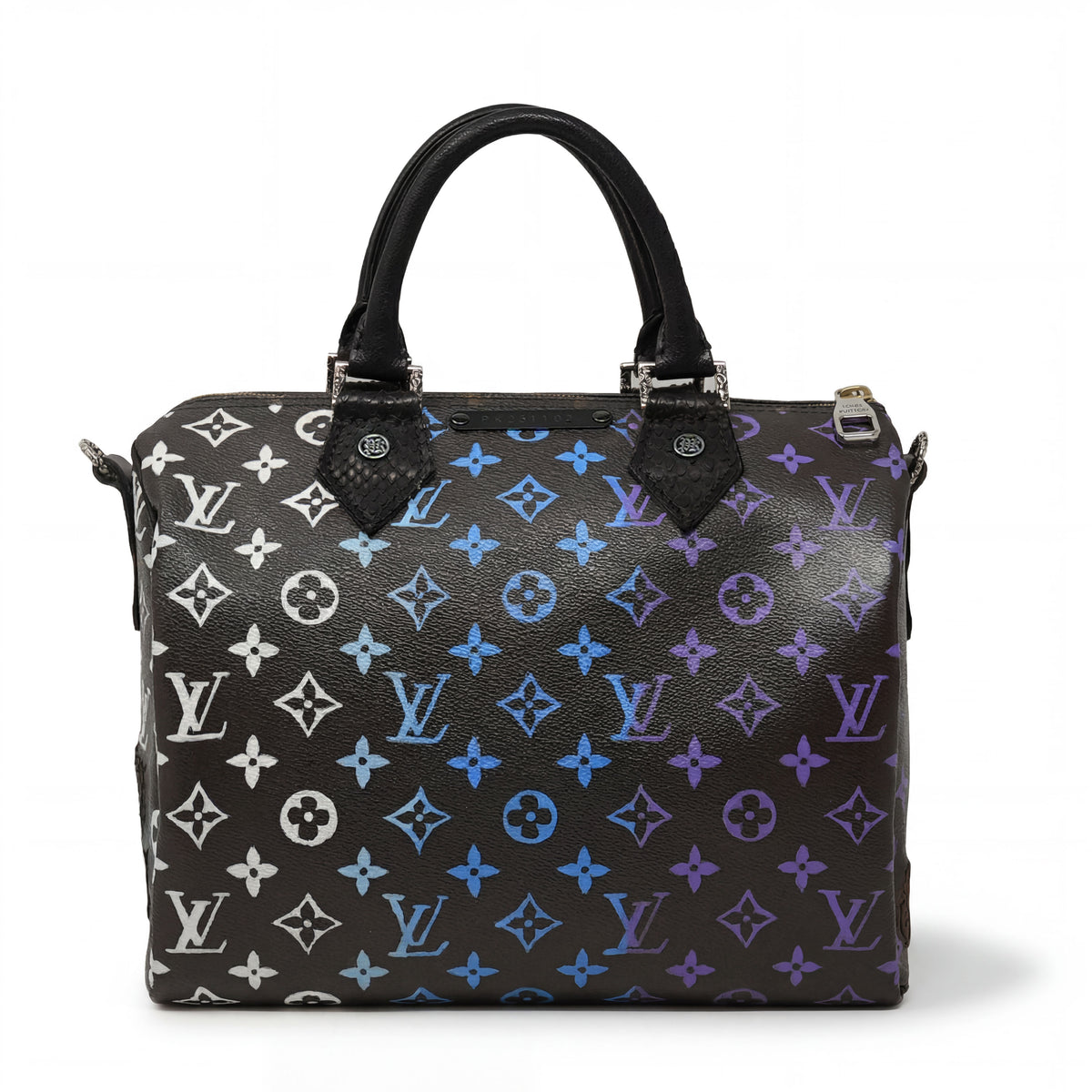 Designer handbag with colorful monogram pattern on a white background.