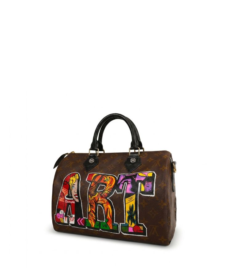 A brown Louis Vuitton monogram handbag with black leather handles and a colorful 'ART' graphic on the front, set against a plain white background.