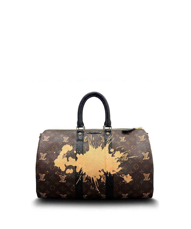 Philip Karto vintage Louis Vuitton handbag with gold splash design on a white background