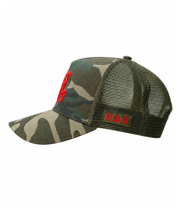 Side view of camouflage PK Cap "Not For Everyone" Model by Philip Karto with red orange embroidered USA logo.