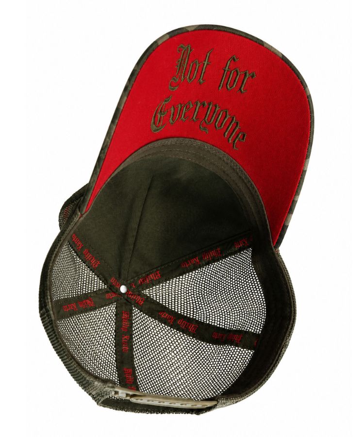 A red orange and camouflage trucker-style cap shown from an overhead angle, featuring the text 'Not for Everyone' in a gothic font on the red front panel by Philip Karto.