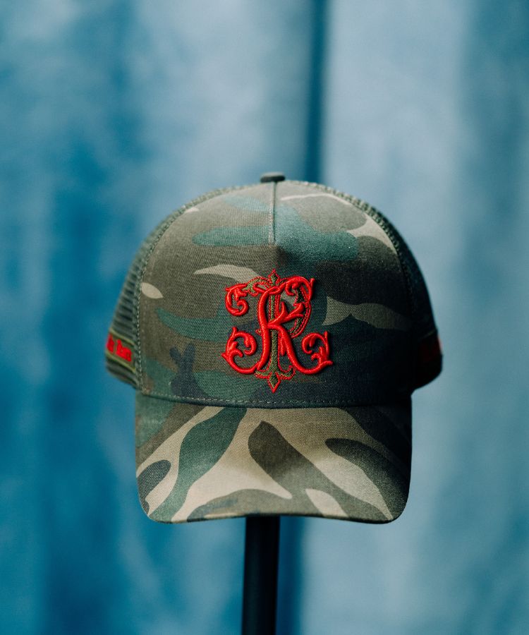 Camouflage PK Cap "Not For Everyone" Model by Philip karto with red logo on a blue background