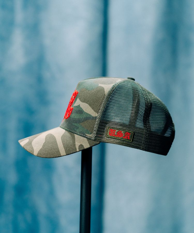 Camouflage PK Cap "Not For Everyone" Model by Philip karto with red logo on a blue background