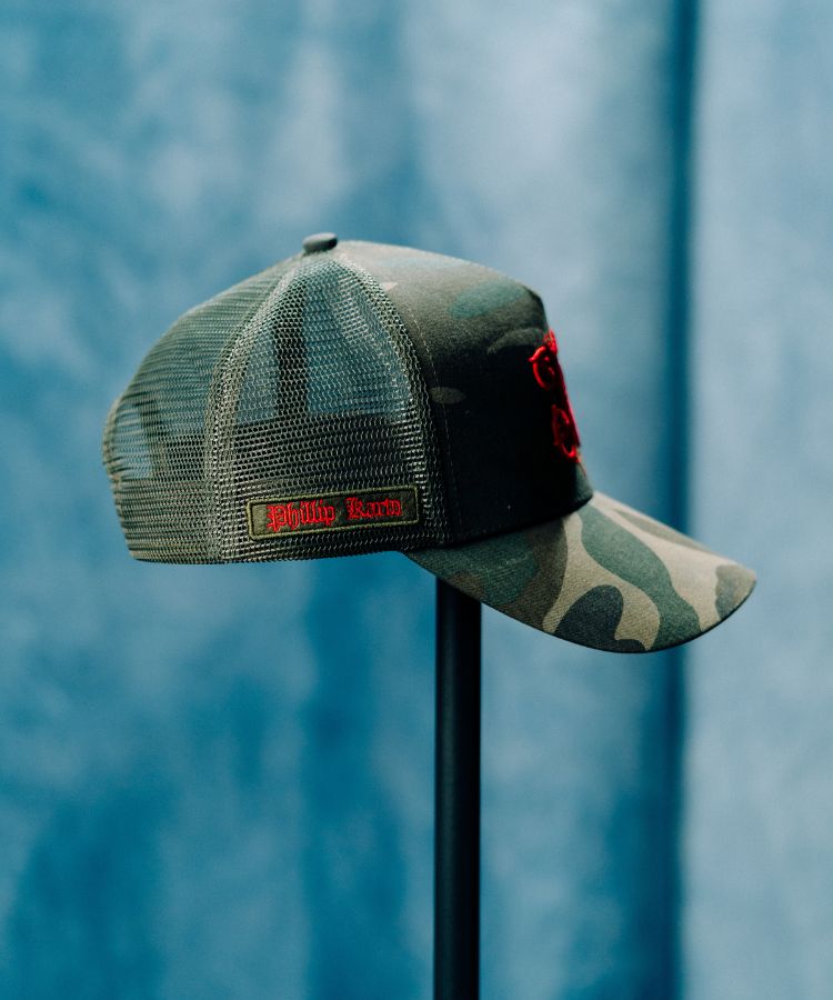 Camouflage PK Cap "Not For Everyone" Model by Philip Karto with a brand logo on a blue background