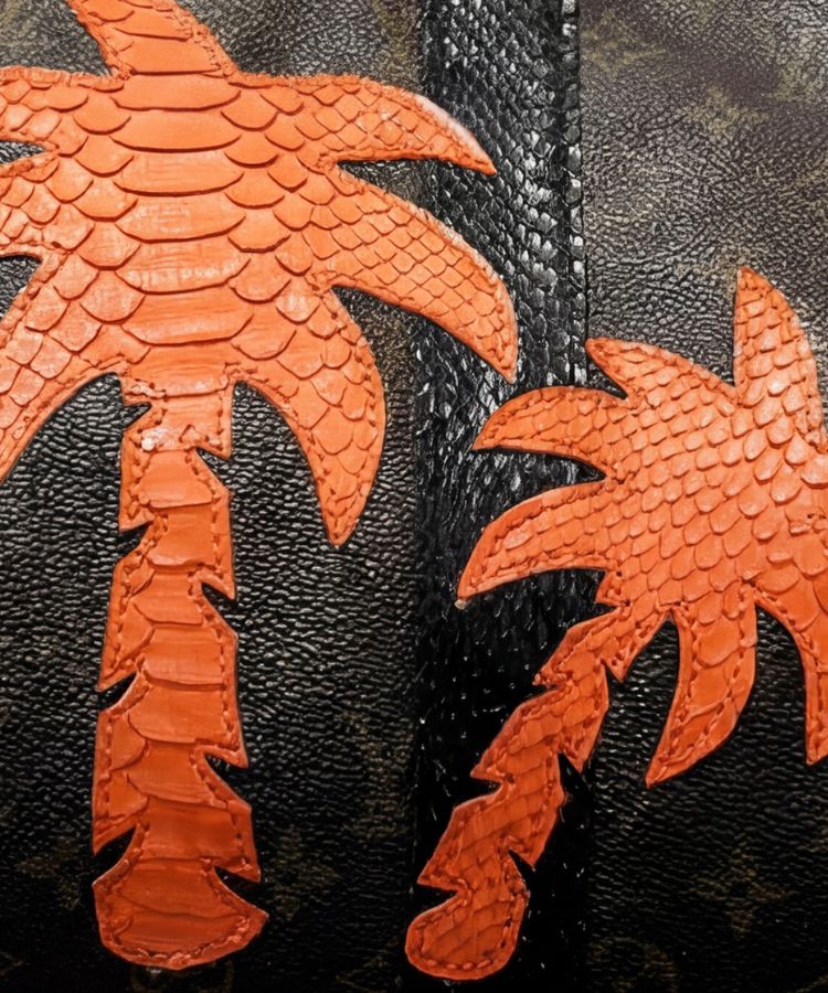 closeup of Philip Karto PK.05 Palms Python Speedy bag in orange with python leather palm tree pattern patches on a vintage Louis Vuitton monogram canvas