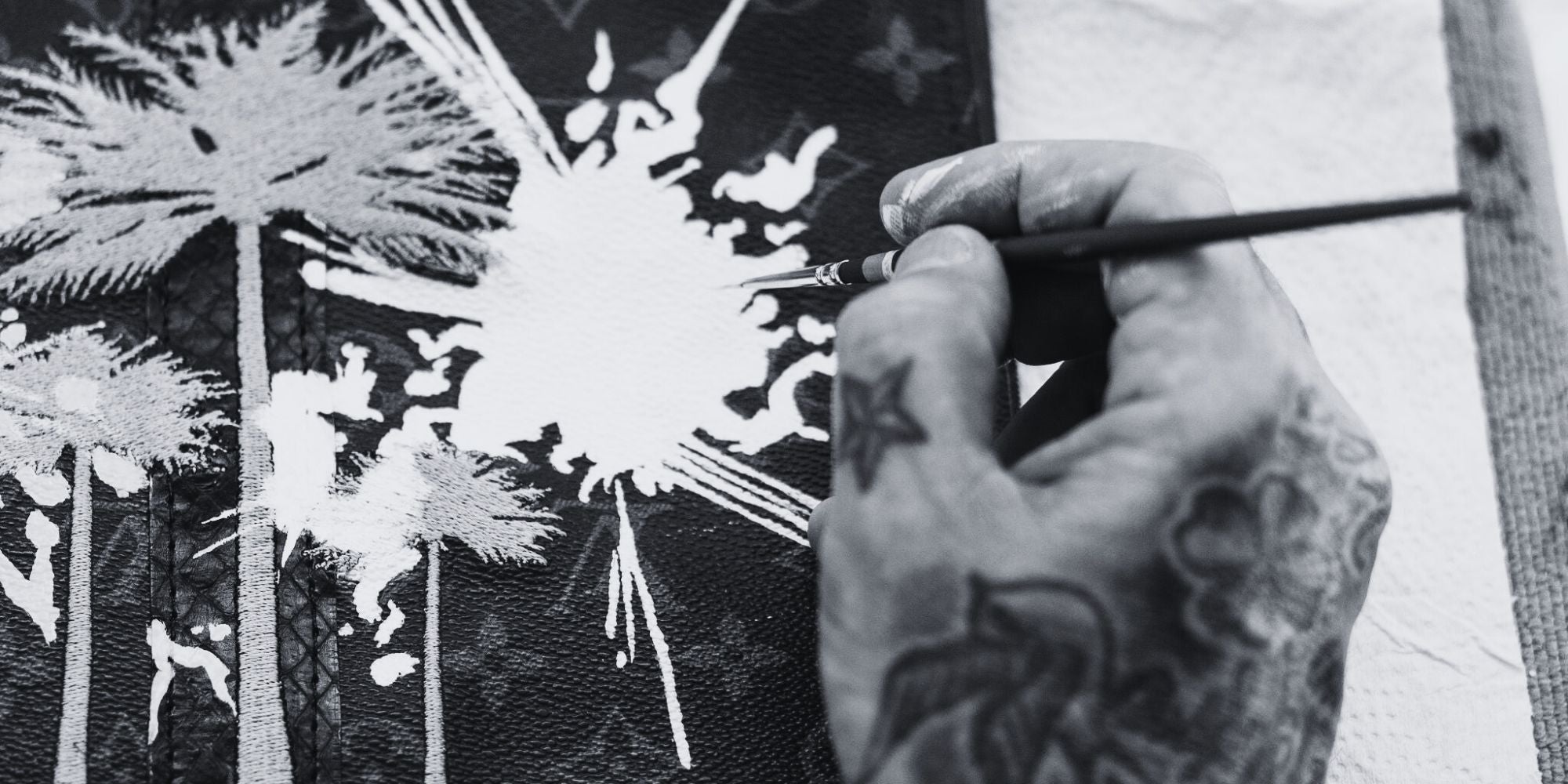 Philip Karto's hand painting on a Louis Vuitton monogram canvas, during the transformation process of the vintage bag.