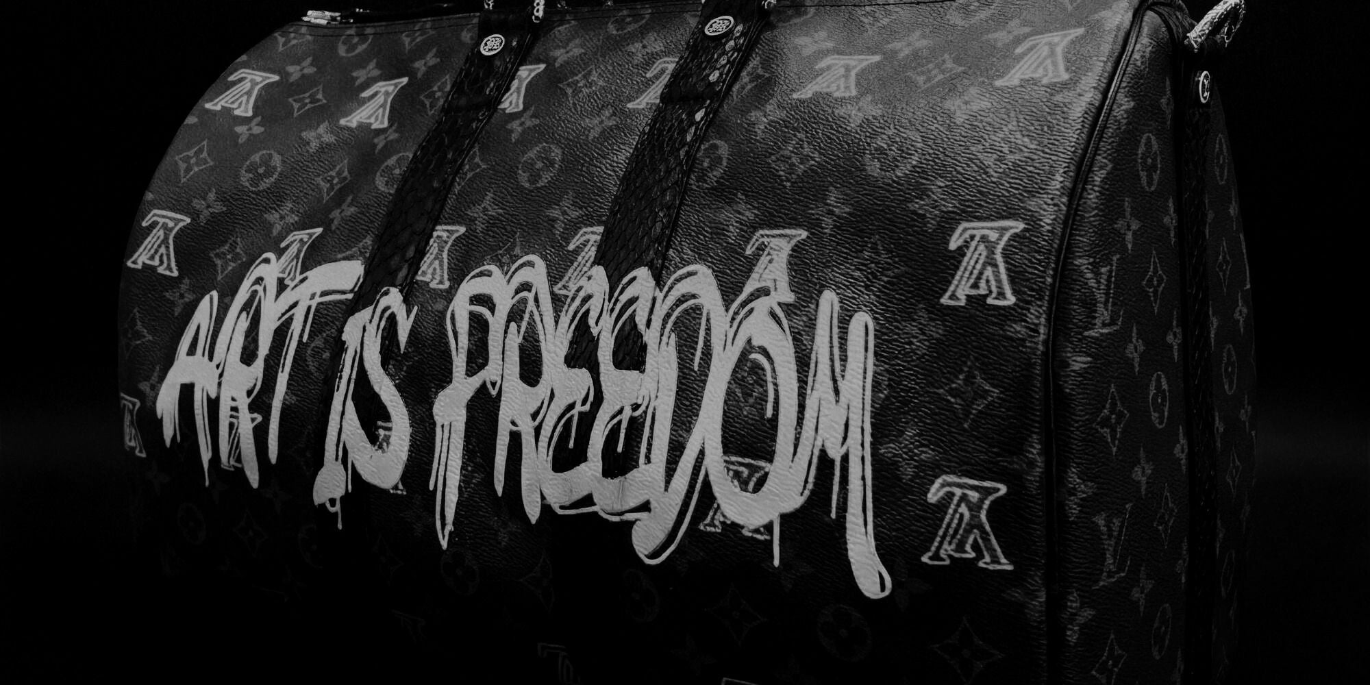 Atr Is Freedom Louis Vuitton Keepall bag by Philip Karto. Close up in black and white showing the painted monogram and Art Is Freedom design.