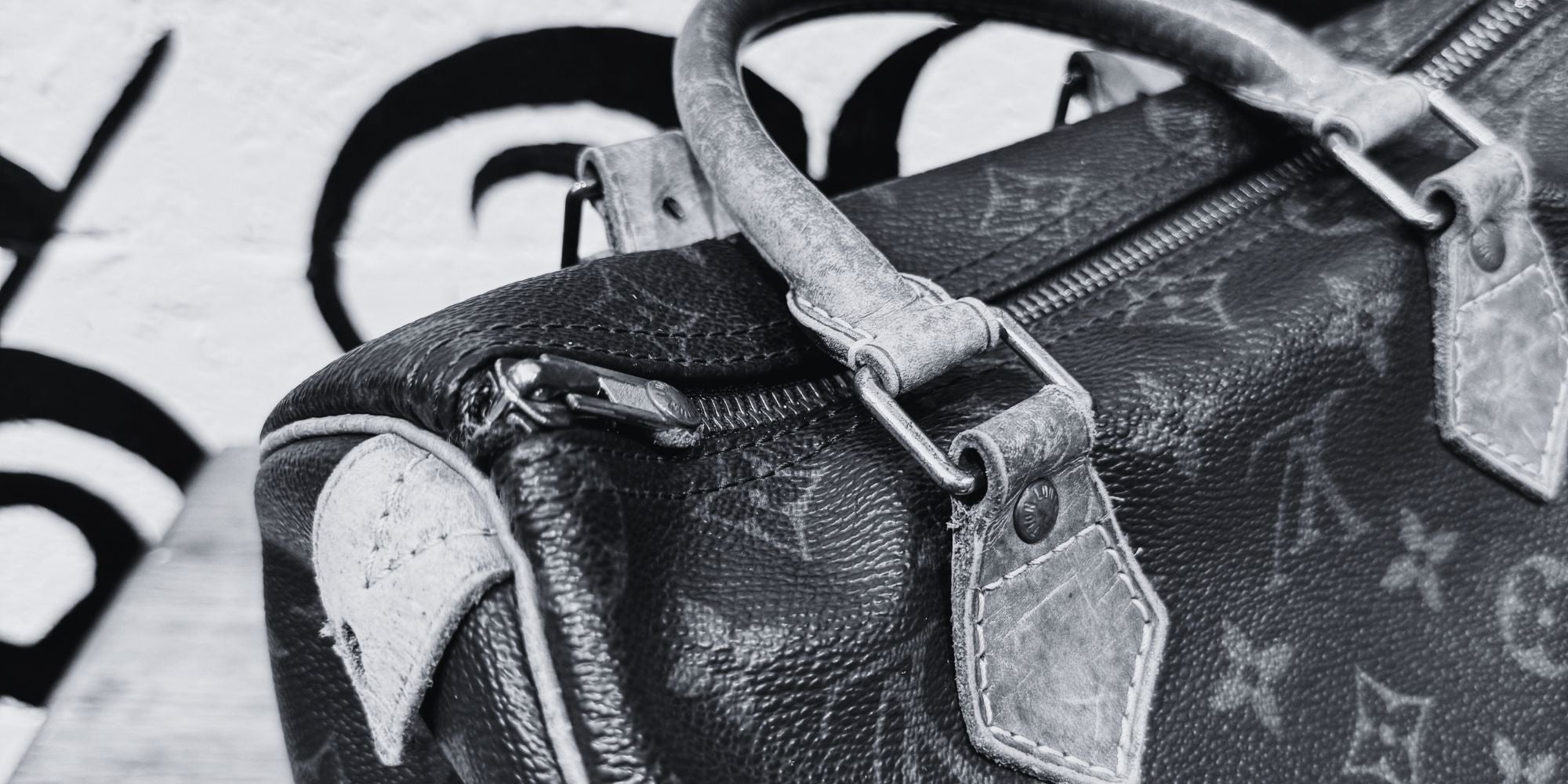 Authentic Louis Vuitton monogram vintage bag in black and white photography style before transformation by Philip Karto