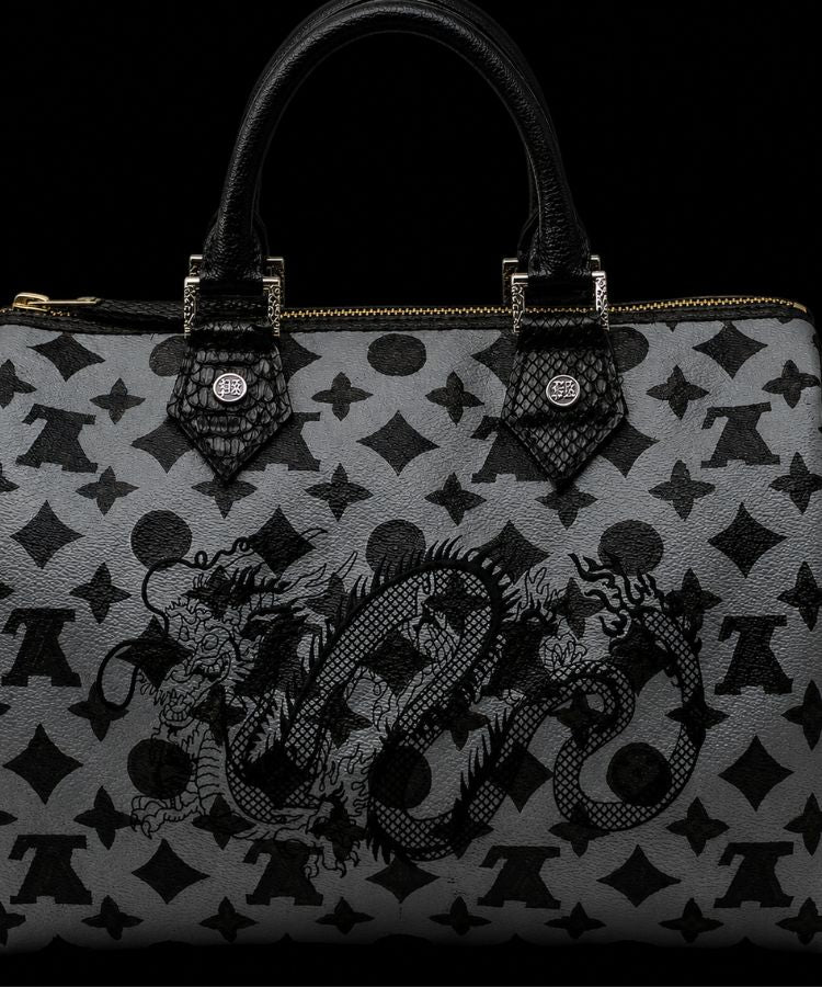 Lous Vuitton Speedy 30 handbag with intricate pattern and brand logo on a black background by Philip Karto