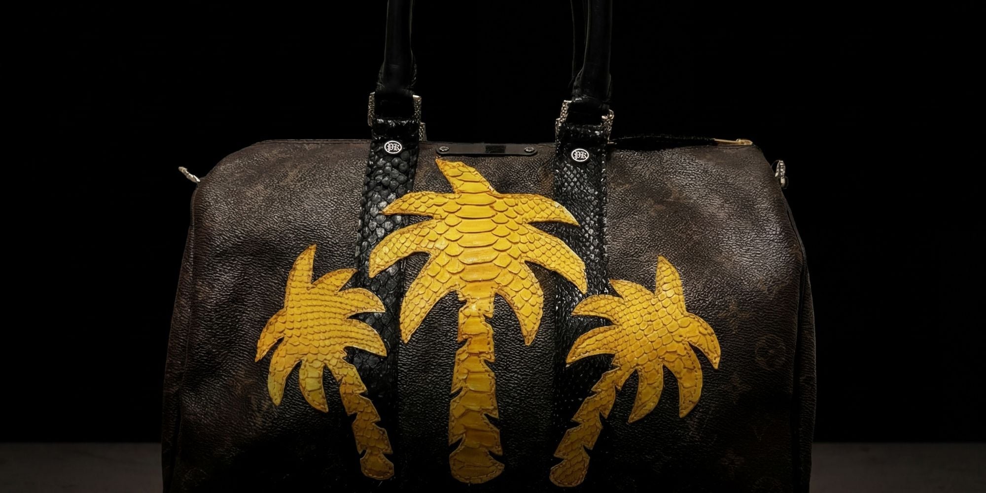 Vintage LV Speedy 35 handbag upcycled by Philip Karto on a black background - Model PALMS from the PK.05 Collection for desktop horizontal format