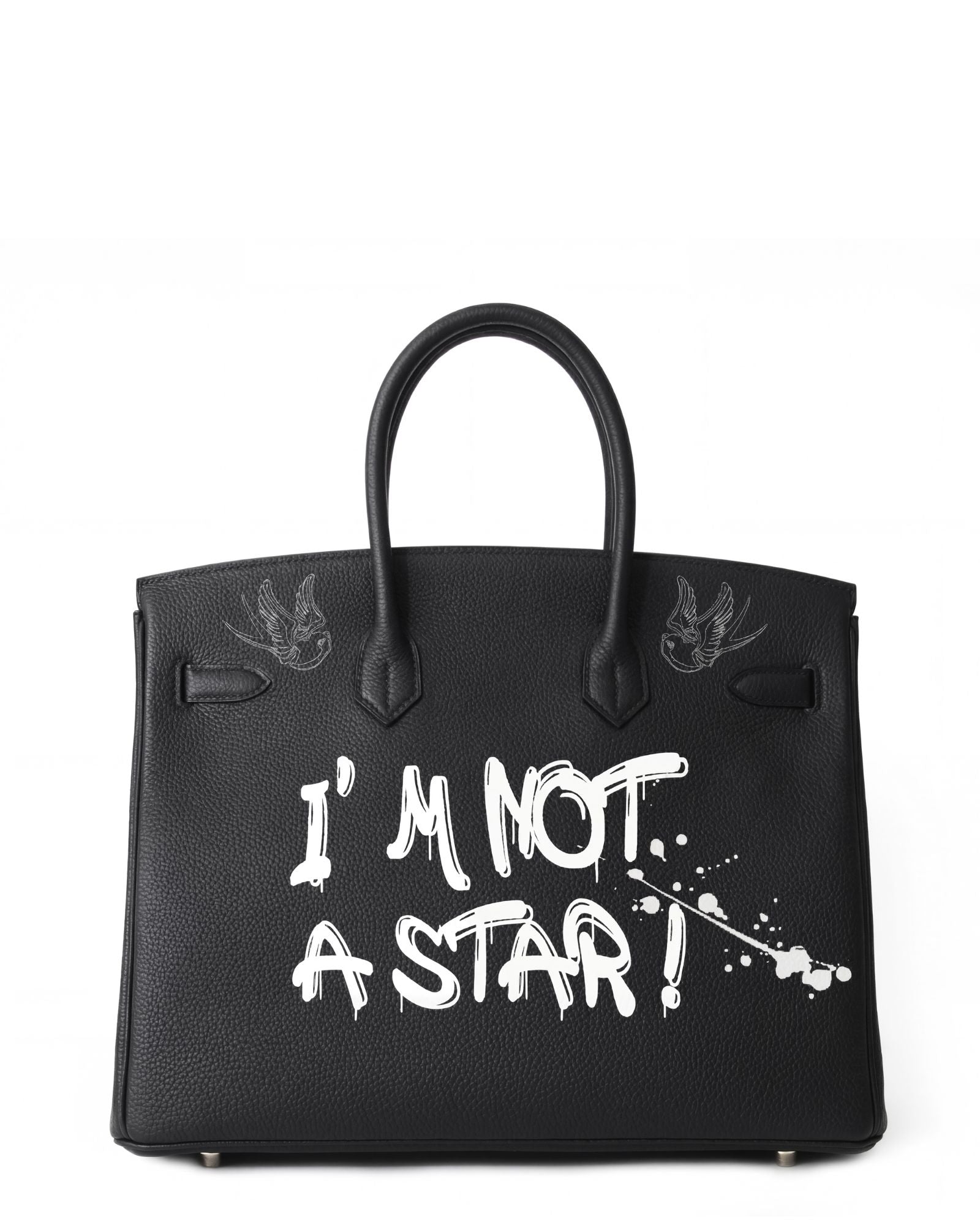 Black Philip Karto vintage Birkin Hermes handbag with 'I'm Not a Star!' text on a white background