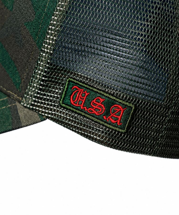 Close-up of the Camouflage PK Cap "Not For Everyone" Model by Philip Karto mesh cap with a red and black 'U.S.A' logo on a blue background