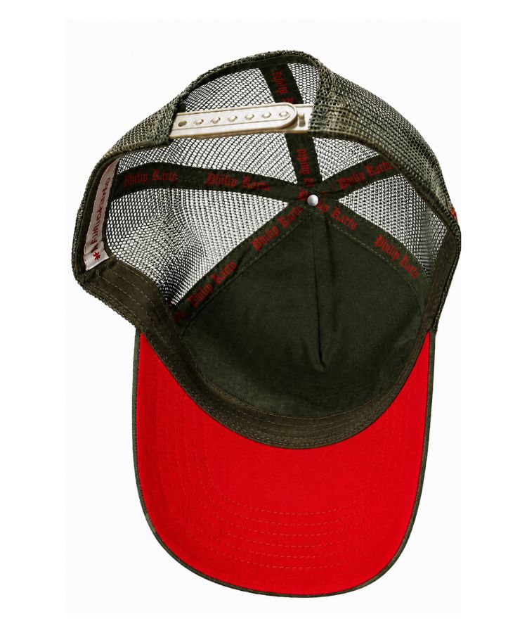 A trucker-style baseball cap shown from below, featuring an olive green mesh back, a red-orange curved brim, and an adjustable strap with a red-orange finish by Philip Karto.